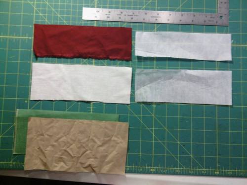 Once you know how wide you want the finished pocket opening to be, cut the welt (the off white piece on the left) to be 2" longer than that.  If you want a pocket with a 6" opening, cut the welt 8 x 3".  Cut an underwelt the same length but 1/2" shorter.  In this case, it's 8 x 2 1/2" and the maroon piece. Cut a piece of interfacing for the welt 1/4" smaller than the welt (7 3/4" x 2 3/4") and a piece for the underwelt 1/4" smaller (7 3/4" x 2 1/4"); they're the white pieces on the right.  Cut the pocket bag pieces to be the same width (8" in this case) and the depth you need.  For the vests I made, they're only 2-3" deep.  For a breast pocket, at least that deep, but maybe deep enough for a pen or a glasses case.  The green pocket bag piece is the shorter one, 3 1/2", and gets sewn to the underwelt.  The tan piece gets sewn to the welt and is 4".
